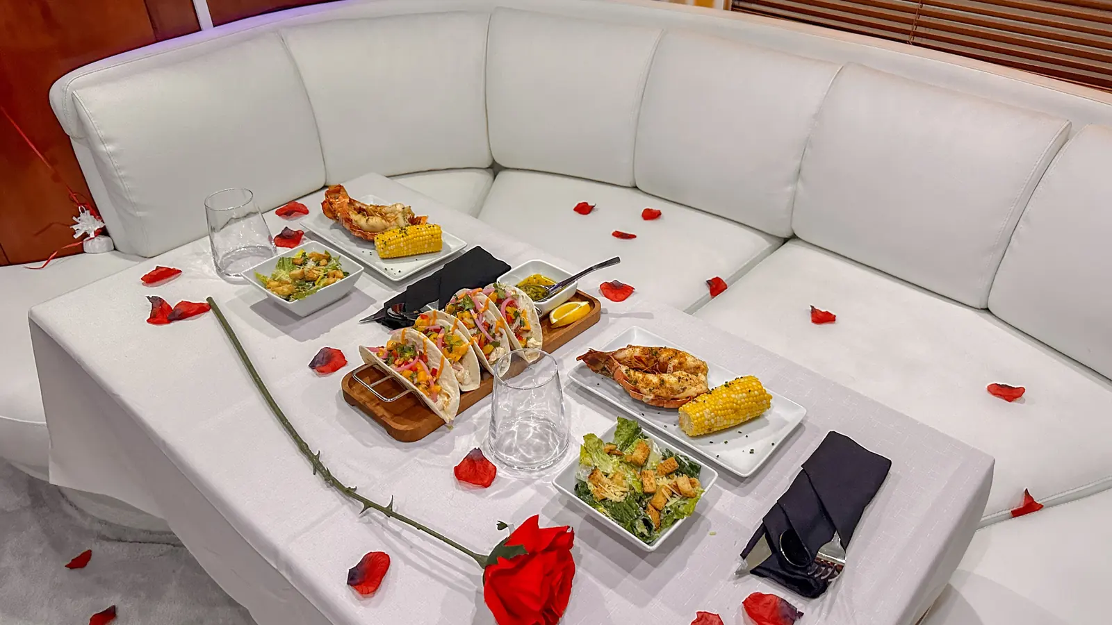 Elegant onboard table prepared for a private yacht charter