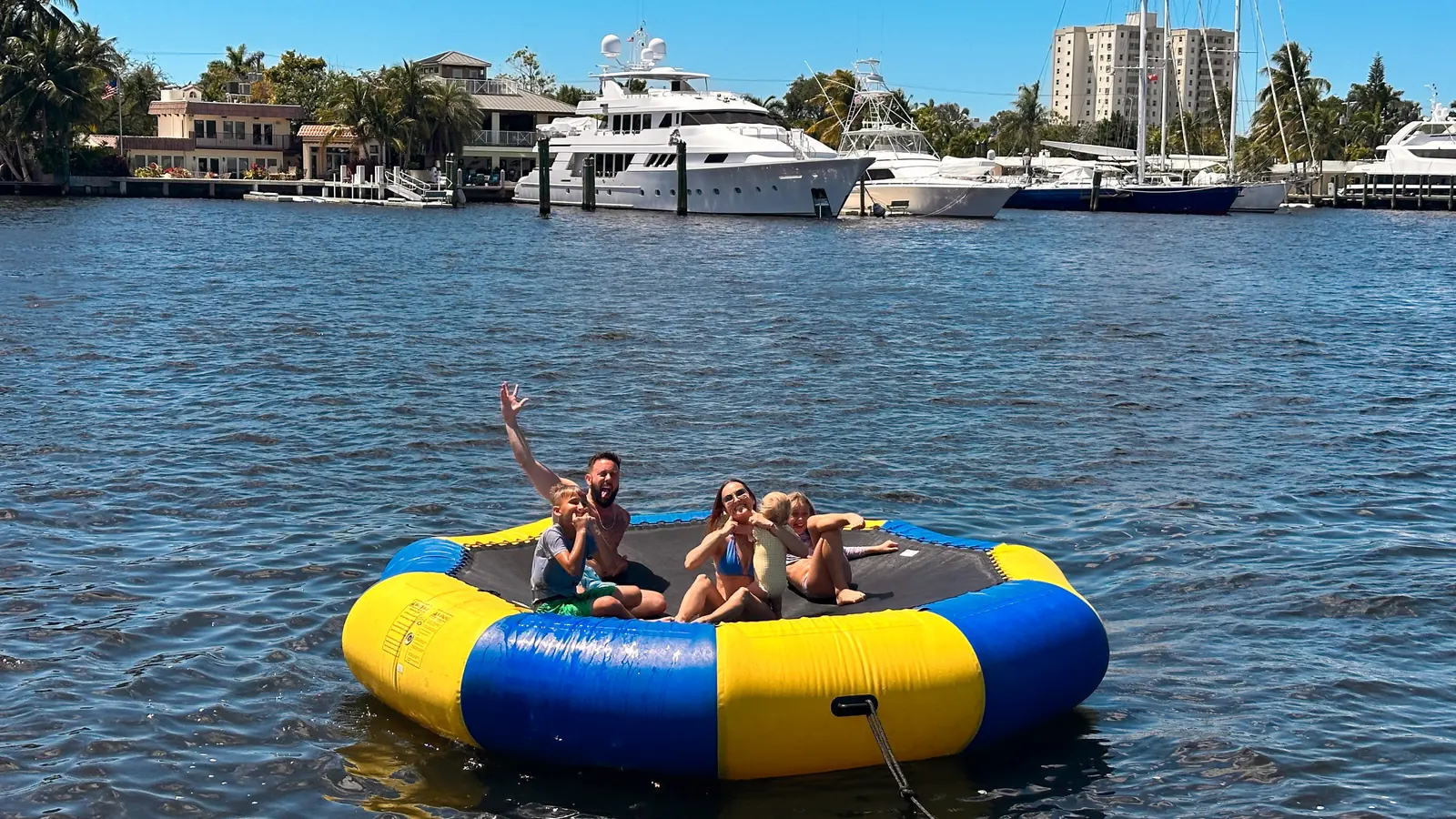 Friends relaxing on a floating tube during a Fort Lauderdale bachelor party boat charter