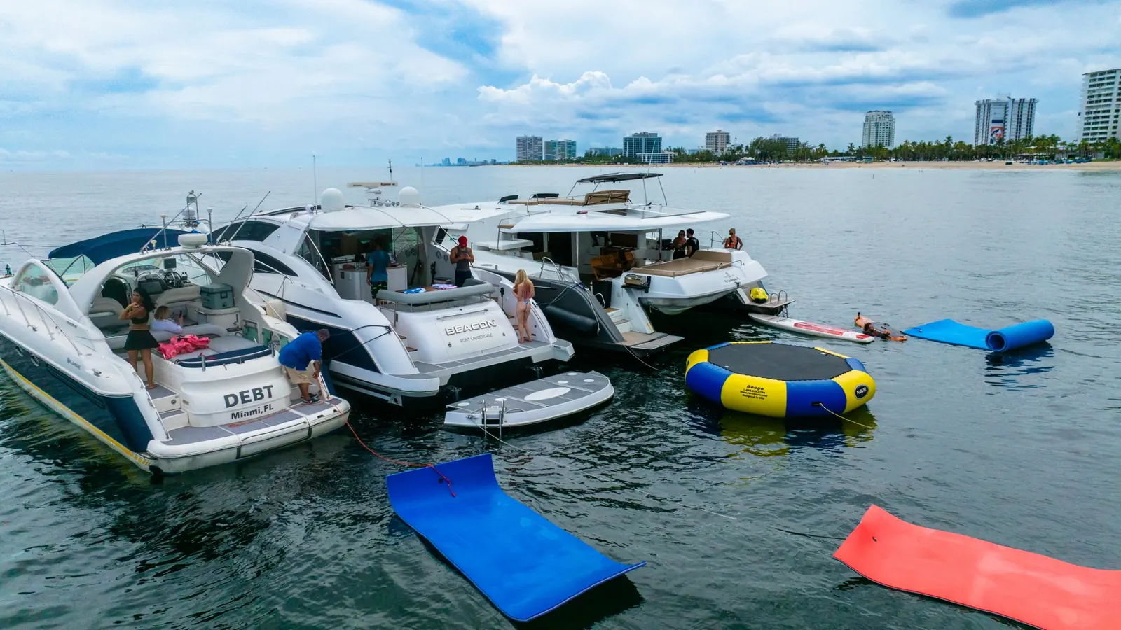 Flamingo Yacht Charters fleet lined up on the water