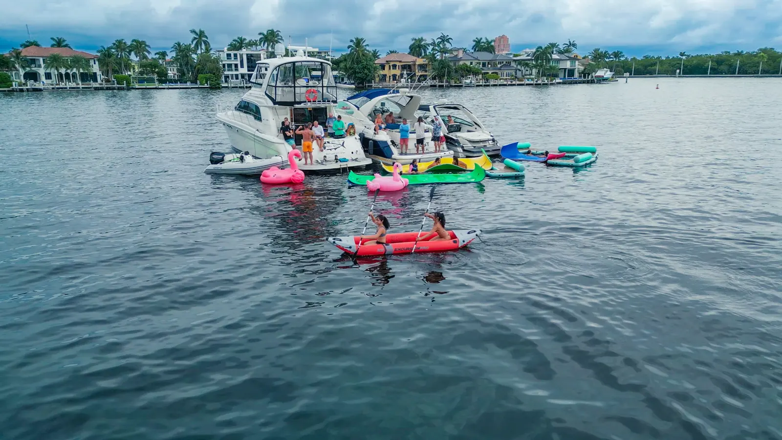 Wide aerial view of multiple private charter yachts