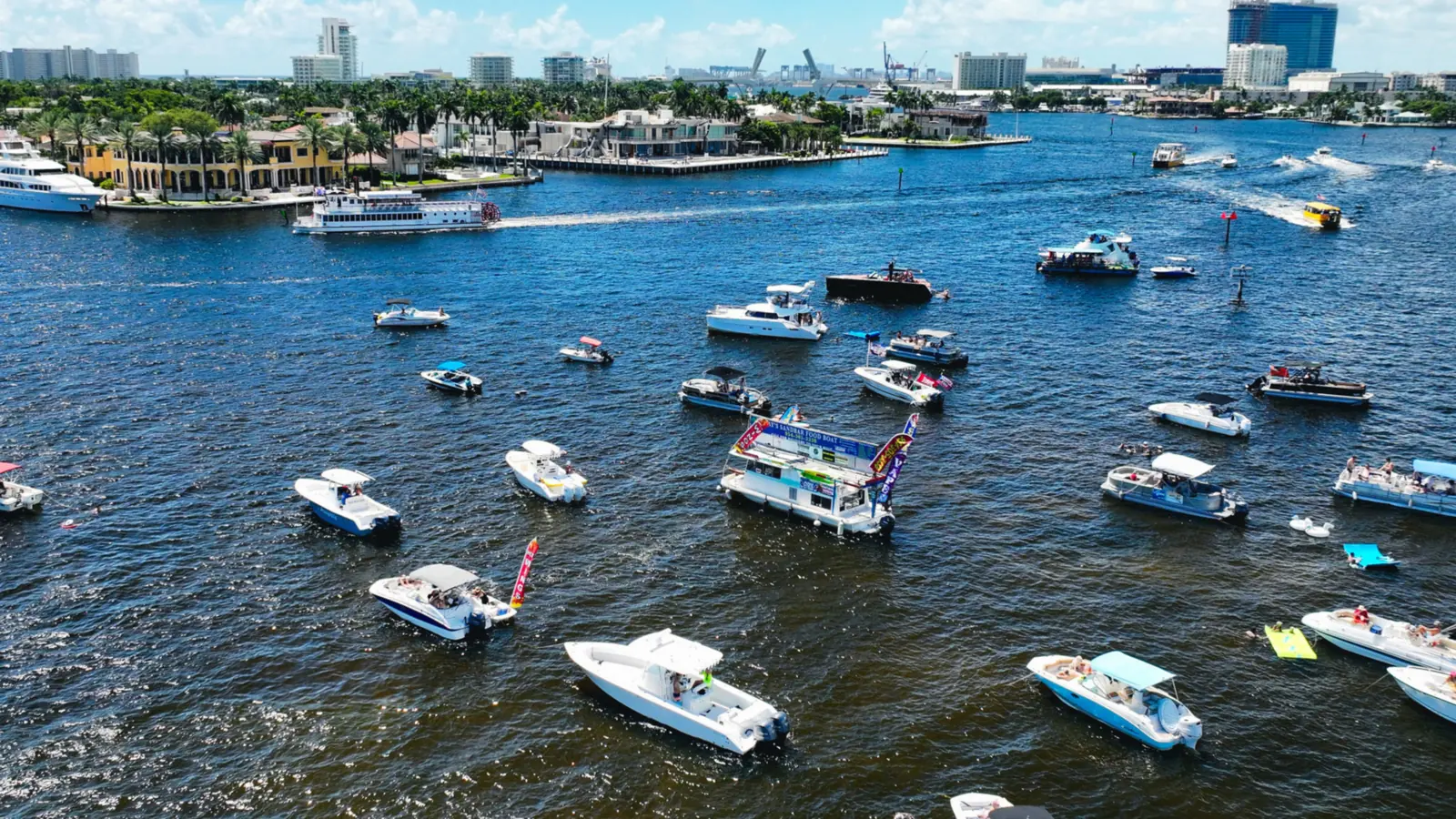 Boats anchored together at a clear-water South Florida sandbar