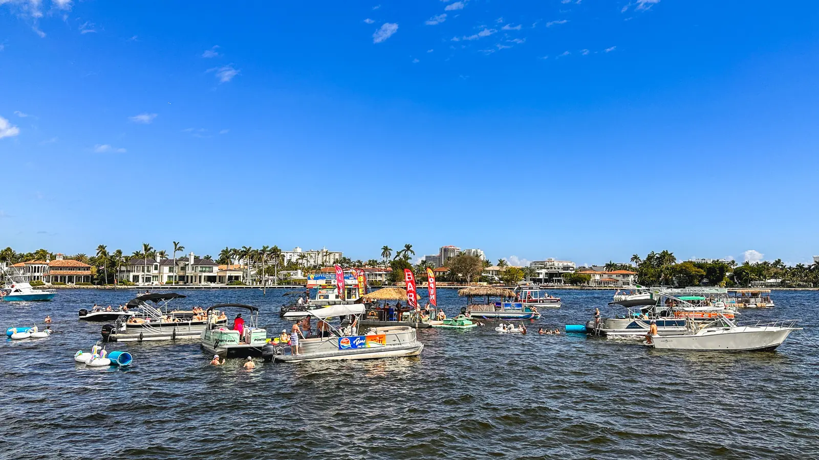 Guests and colorful floats gathered at a South Florida sandbar