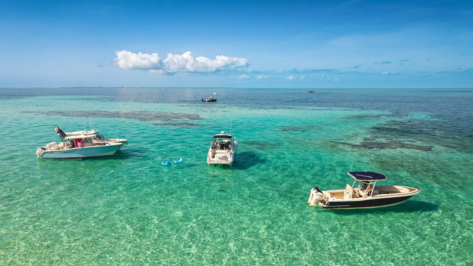 Private yacht cruising through turquoise water on a Bimini charter from Fort Lauderdale