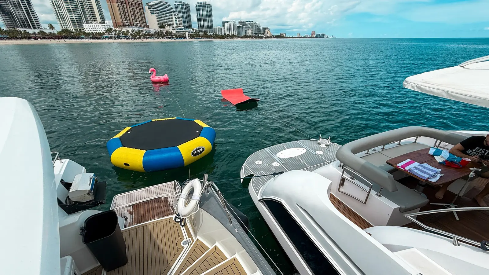 Floating watersports equipment ready beside a yacht