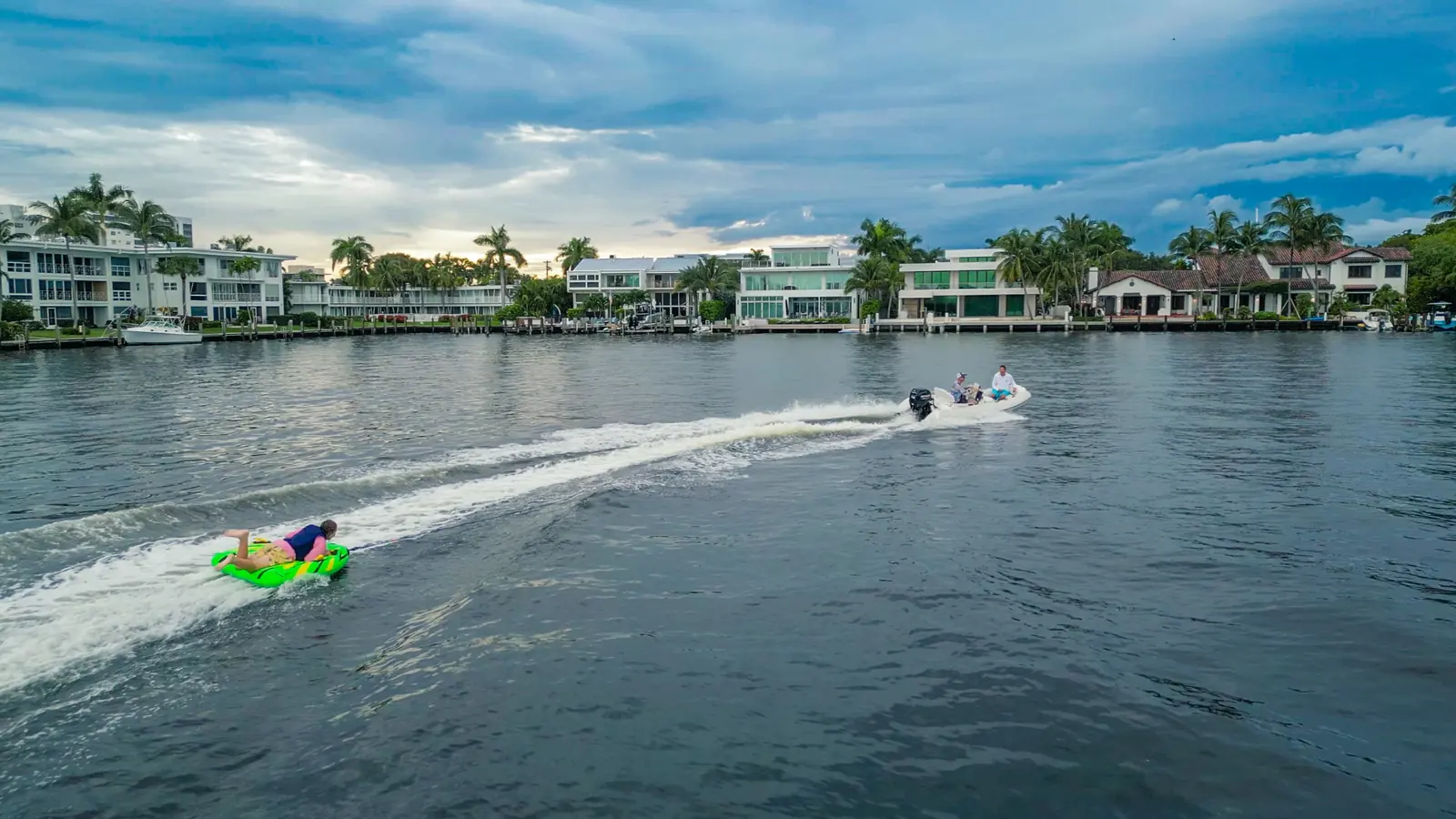 Wide view of a guest being towed behind a boat