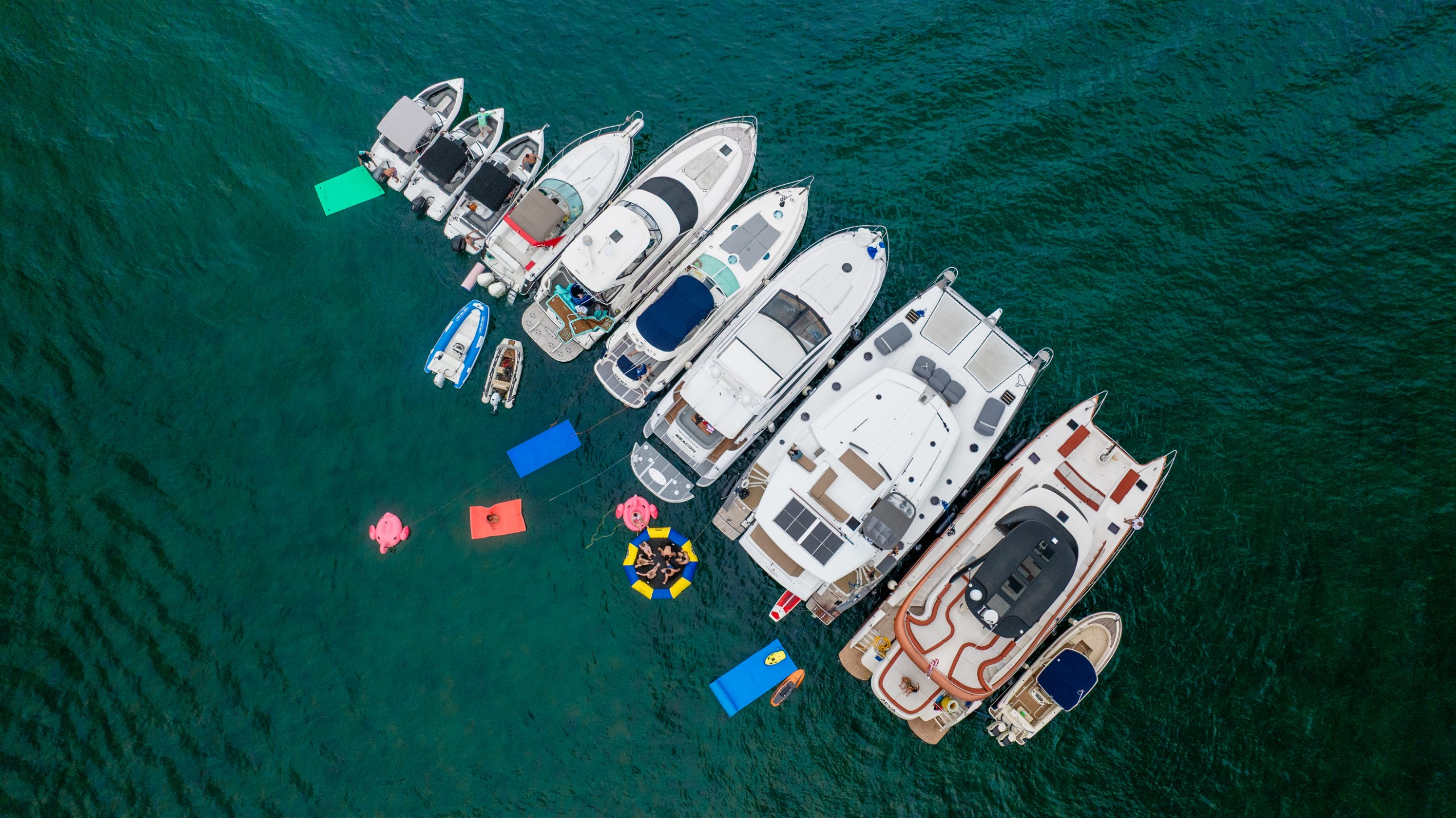 Aerial view of Flamingo Yacht Charters yachts anchored together on turquoise water